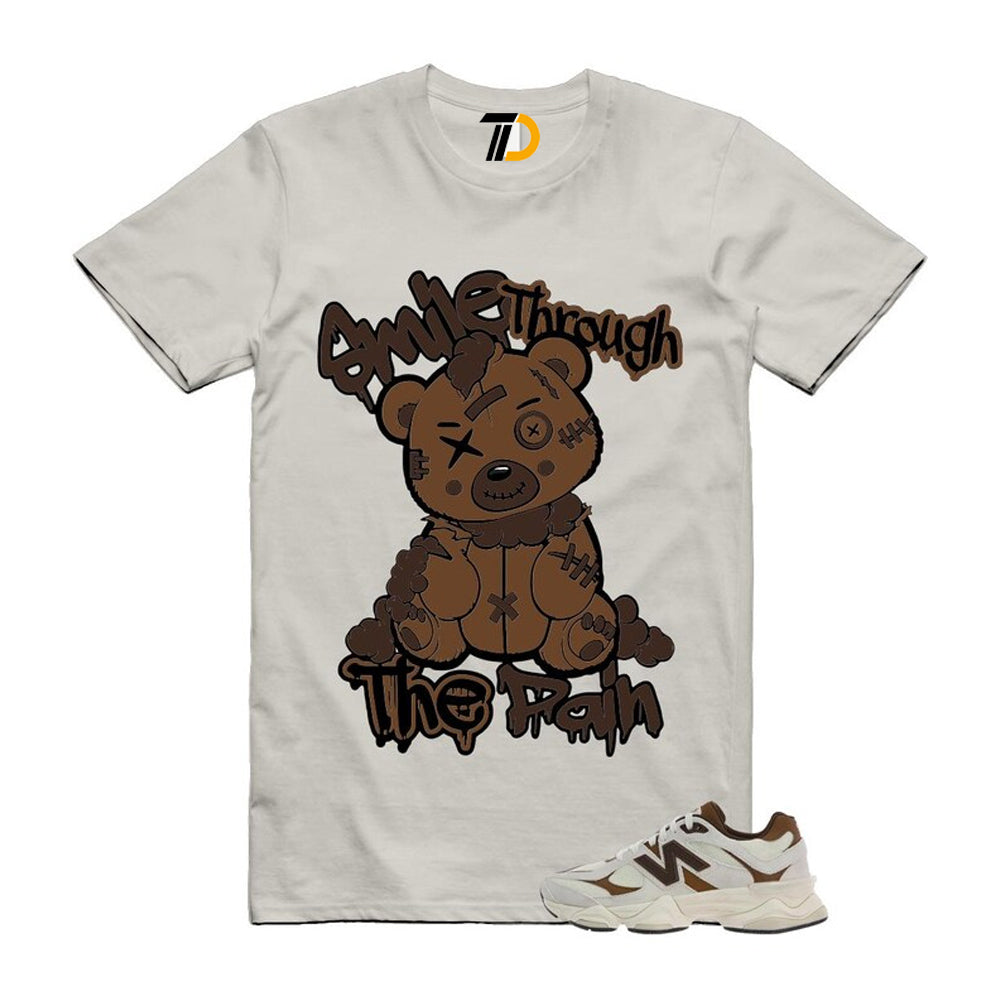 9060 Breakfast Tea Angora Brown Shirt To Match Smile Through The Pain T-Shirt 2026