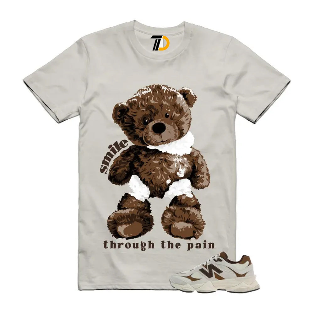 9060 Breakfast Tea Angora Brown Shirt To Match Smile Through The Pain T-Shirt 2026