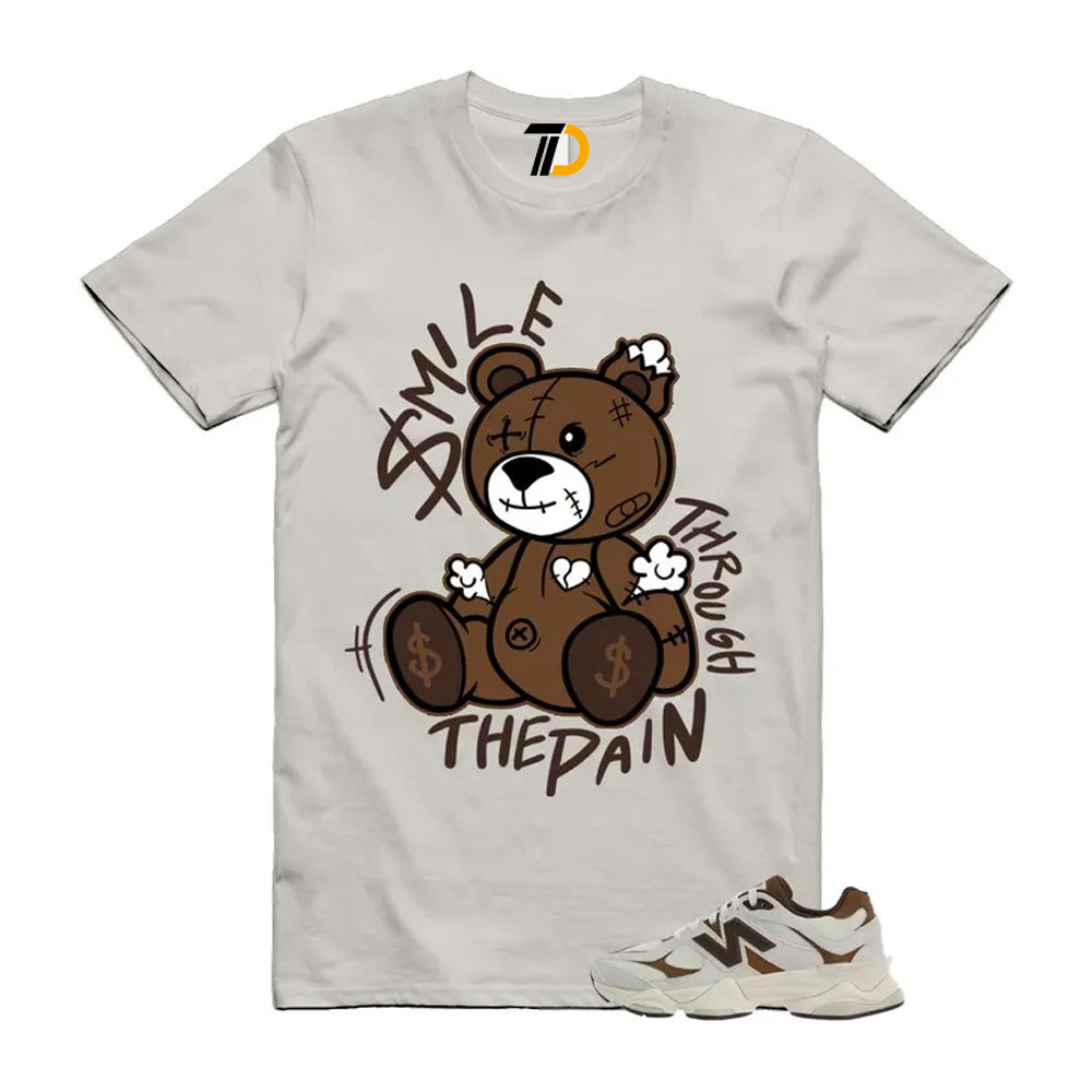 9060 Breakfast Tea Angora Brown Shirt To Match Smile Through The Pain T-Shirt 2026
